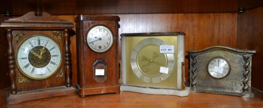 Four examples of 20th century mantle clocks