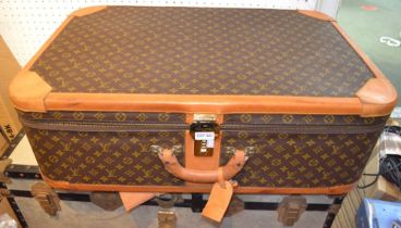 A Louis Vuitton suitcase, 80cm x 53cm x 26cm