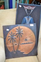 A beaten copper picture of tropical islands with another