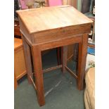 An old pine clerks desk set on later stand