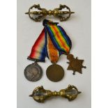 A collection of three WWI military medals, awarded to 11345RA Marshal RA, together with two Buddhist