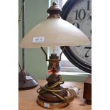 A wood and brass table lamp