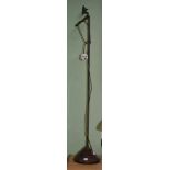 A brass adjustable reading lamp - Ex Felix Denis