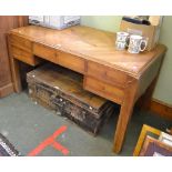 A probably continental mahogany desk with inlaid star motif, five drawers to the front