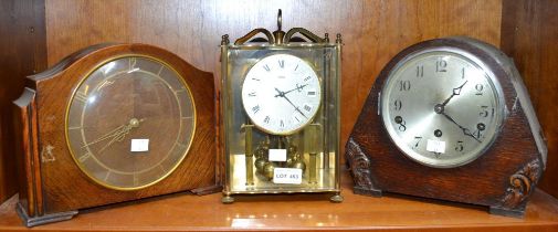 An anniversary clock with two 20th century mantle clocks