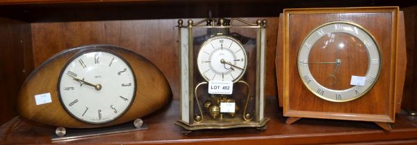 An anniversary clock with two mid-century mantle clocks