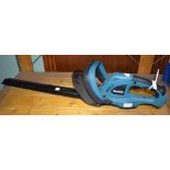 A Makita DUH523 battery hedge trimmer