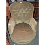 A green upholstered button back nursing chair