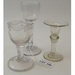 An 18th century glass, with facet cut stem and circular platform foot, together with two other small