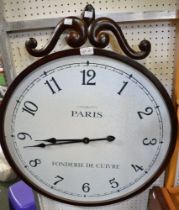 A large decorative wall hanging clock