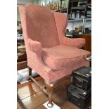 A wing chair for reupholster