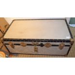 A metal bound steamer trunk