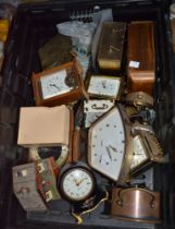 A crate containing a good selection of vintage mantle clocks