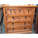 A Corona pine chest of seven drawers