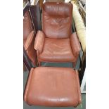 A Swiss made brown leather armchair with matching foot stool ex Felix Denis