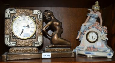 Two decorative mantle clocks each decorated with a maiden