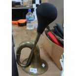 A vintage brass bulb form car horn