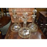 a trio of glass wine vessels - two decanters with stoppers and a claret jug and stopper