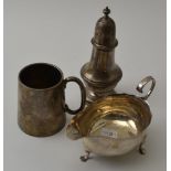 A silver caster of Georgian form, Chester 1912, 14.5 cm high, together with a silver Christering mug