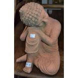 A solid terracotta statue of a Buddhist worshipper 34 cm high