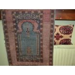 Silk woven prayer rug with much script to boarder sold with a carpet cushion