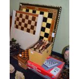 Chess boards, chess sets and an electronic chess instructor