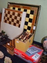 Chess boards, chess sets and an electronic chess instructor