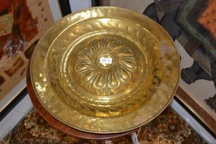 A pair of17th century style, German brass circular alms dishes, the 19th century, domed and spiral