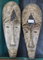 A matched pair of African carved and painted wood masks - Felix Dennis collection