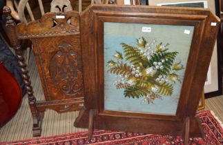 An oak framed fire-screen inset needle and bead-work panel with another example