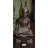 Cast metal bronzed Buddah seated upon a lotus 43cm high