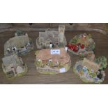 A collection of six "Lilliput Lane" cottages includes periwinkle cottage