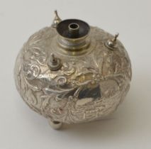 A Dutch silver table lighter of embossed bun form, decorated with three landscapes, amidst foliage,
