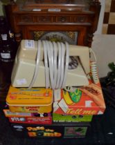 A retro dial trim-phone plus a selection of boxed children's games