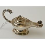 Mappin & Webb, a silver Aladdin's lamp table lighter the C scroll handle with beast mask terminal, b