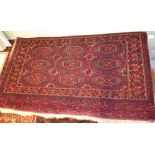 A Tekke Turkoman tent panel, red ground with elephant foot design, fringed on one side, 144cm x 80cm