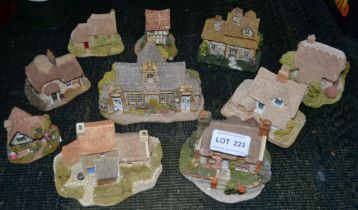 A collection of ten "Lilliput Lane" cottages includes the village school