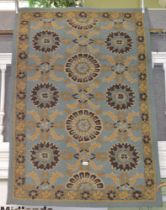 A modern pulled wool blue ground geometric patterned conservatory carpet