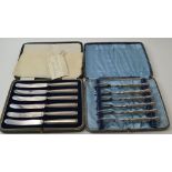 A cased set of six silver handled kings pattern cake forks, Sheffield 1975, together with a cased se
