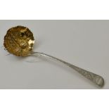 George Day, a George III embossed silver ladle, the bowl with gilded fruits, London 1816, weight: 40