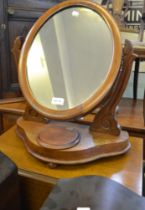A two-tier oak tea trolley and a Victorian dressing table mirror