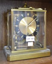 A Schatz brass mantel skeleton clock