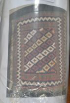 An Eastern wool rug fringed and bordered
