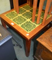 A funky tile top mid-century occasional table