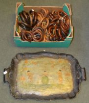 Decorative painted tray with a selection of vintage wooden curtain pole rings