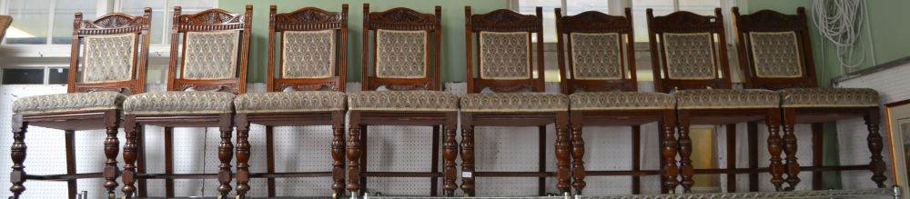 A set of eight oak dining chairs, upholstered seats and backs c.1900, bearing labels beneath "Chambe