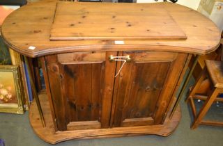 A pine catering trolley with inset cutlery well top