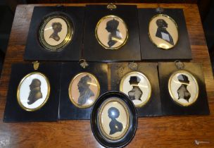 A selection of 19th century black framed silhouettes, mostly painted