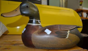 A carved wooden decoy duck (Mallard) with glass eyes