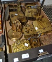 A box of vintage clock movements for restoration purposes